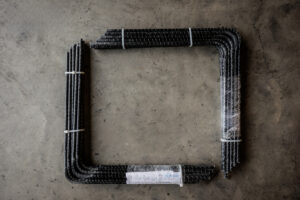 Two bundles of black bars arranged in a square