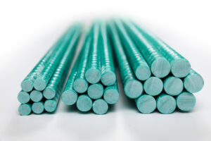 Three piles of green coated tendons