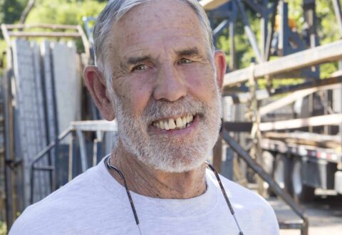 Buck Bartley smiles at the camera while at a job site.
