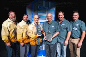 Six employees of Western Forms Inc accepting their award.