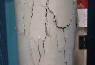 A cylinder of concrete with cracks in it.